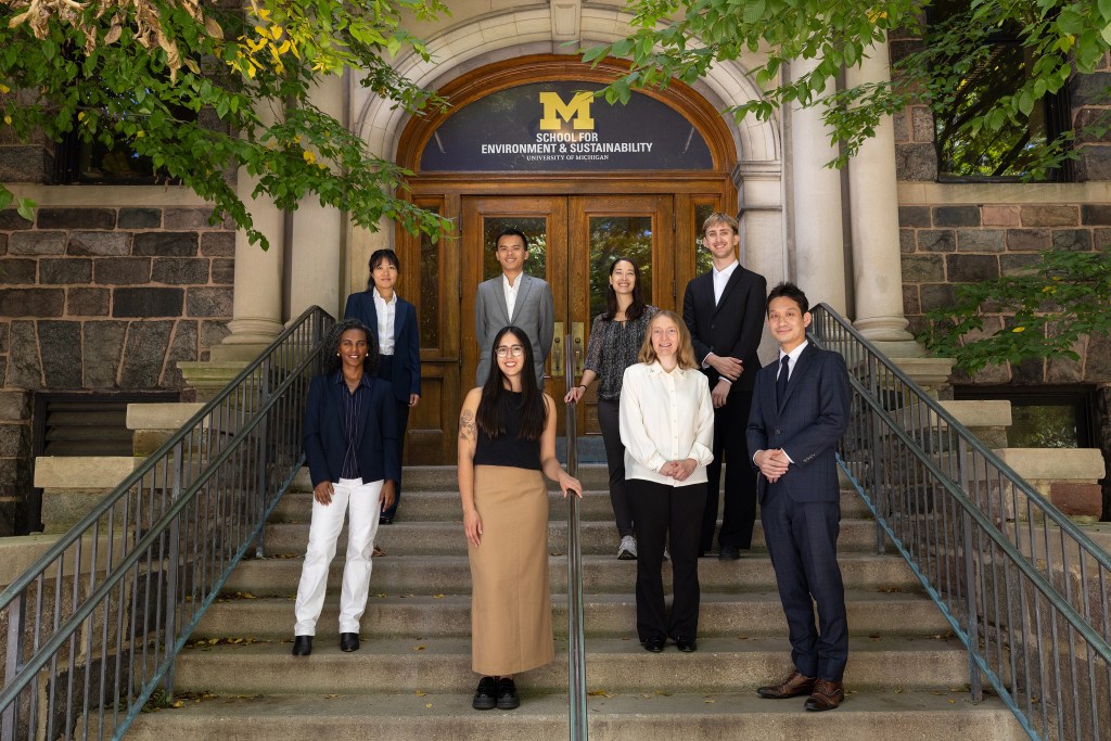 The Climate Blue COP 31 delegation standing on the steps of the School for Environment and Sustainability at the University of Michigan